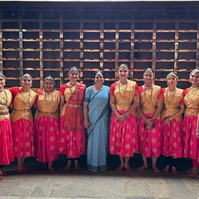 With my Guru, Smt. Revathi Srinivasraghavan, and my fellow dancers during a dance tour. Being part of an ensemble is about creating a cohesive visual story, and the bonds we share offstage make our performances even more special.