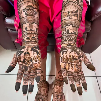 A complete bridal look, with stunningly detailed mehendi on both hands and feet. The design features family portraits, auspicious symbols, and traditional patterns.