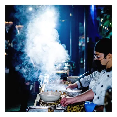 The dramatic plume of smoke from a sizzling tawa station creates an exciting and aromatic focal point at any event. Our chefs engage with guests as they prepare flavourful dishes live, adding a dynamic element to the culinary experience.