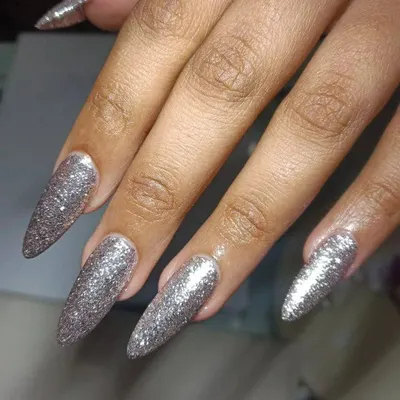 These long, stiletto-shaped nails are all about the sparkle. A full coat of silver glitter gel makes for a dazzling and high-impact look that is always in style.