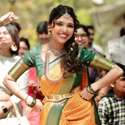 The vibe of a bride who is unapologetically herself. Jothi looks absolutely radiant and full of life in a custom-designed yellow and green checked saree for her engagement.