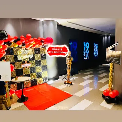 We brought the glamour of the movies to an 8th birthday with this Bollywood theme decoration. The setup included a red carpet entrance, a custom birthday sign, an Oscar statue prop, and a movie clapperboard for the perfect themed photo op.