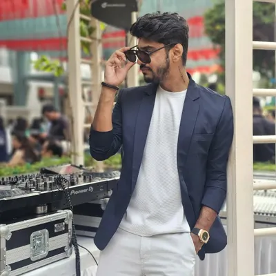 A cool, confident look for a daytime event. Leaning against my console in a blazer and sunglasses, ready to bring the vibes.