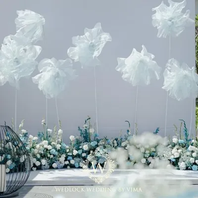 We created a dreamy photo-op for a poolside brunch with these life-sized, cloud-like florals. The whimsical structures against the clear sky provided a perfect, ethereal backdrop for pictures.