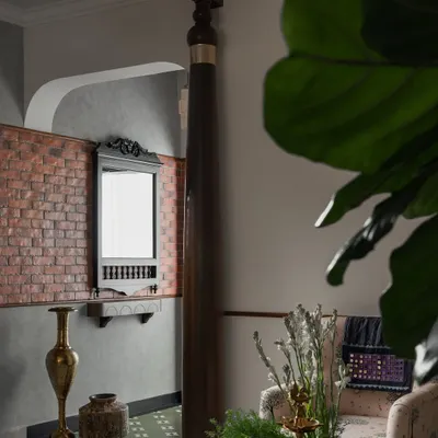 They say first impressions matter, and at my 'Kaalam' project, the foyer sets the tone. The sthamba (pillar) draws your eye instantly, a rooted reminder of tradition, reinterpreted for today. Exposed brick and Athangudi-inspired tiles add nostalgic layers that soften the modern edges.