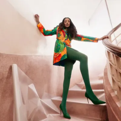 A bold and artistic shot from our editorial with Advait. We paired this vibrant, structured blazer-dress with striking green tights and heels to create a high-fashion look that plays with color and form. The spiral staircase adds a beautiful graphic element to the composition.