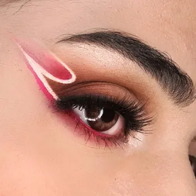 In a pink state of mind. This close-up shows a double graphic liner, blending sharp lines with soft pink tones for a look that's both edgy and dreamy.