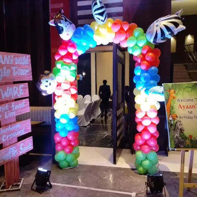 We created a fun jungle theme entrance for Ayaan's first birthday party. The setup includes a colorful balloon gate with animal accents, a custom welcome board, and themed signposts to get guests excited from the moment they arrive.