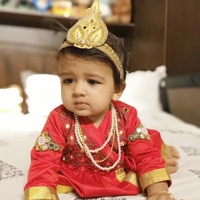 Designing for my own son is one of my greatest blessings. For him, I created this vibrant red Angrakha-style kurta with delicate embroidery and a matching golden crown, perfect for a festive celebration. It's a joy to craft comfortable and unique traditional wear for the littlest members of the family.