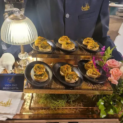 The humble Vada Pao gets a gourmet Italian makeover. Our Vada Pao Bruschetta is a crowd favourite, served on a beautiful brass tray by our staff, showcasing our innovative approach to fusion cuisine.