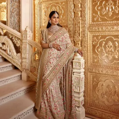 For a major wedding event, we styled Isha Ambani Piramal in this magnificent Manish Malhotra saree. The intricate floral embroidery and regal drape against the palatial backdrop made for a truly timeless look in Indian couture.