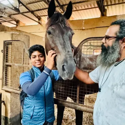 The perfect match is everything. We take great pride in finding the right horse for each rider's ambitions, creating a true partnership. This moment captures the excitement of a young rider meeting his new partner, Dreamboy.