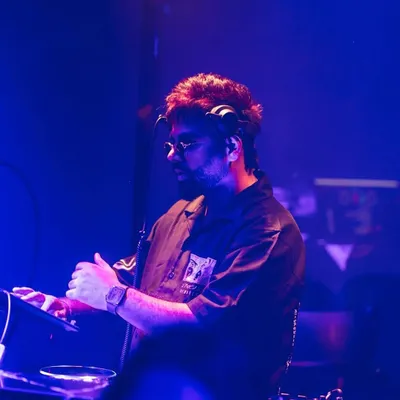 Where words fail, music speaks. A candid shot of me in my element, mixing tracks during a show.