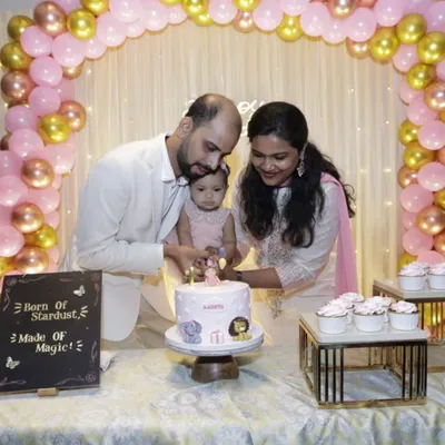 Little Aadira celebrating her first birthday with the pastel animal-themed cake I made for her. Seeing my cake as part of such a happy family moment is truly heartwarming.