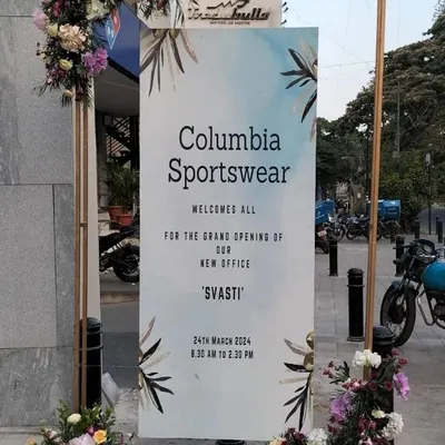 Clear and elegant signage is key for a grand opening. For Columbia Sportswear's new office, we designed and placed this welcome sign, framed with subtle floral accents, to professionally greet and direct guests upon arrival.