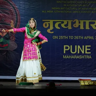 A series of photos from a Gidha performance at a national competition in Pune, showcasing the colorful costumes and lively spirit of this Punjabi folk dance.
