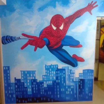 A dynamic Spider-Man mural hand-painted for a child's room, showing the superhero swinging over a city skyline to create an action-packed feature wall.