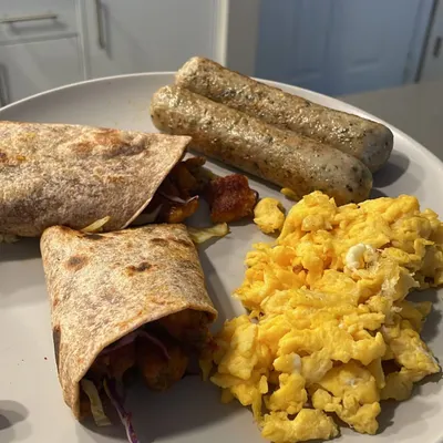 A look at one of my go-to power breakfasts. Scrambled eggs, chicken sausages, and a hearty wrap give me the protein and energy I need to start my day. Eating well doesn't have to be complicated or boring.