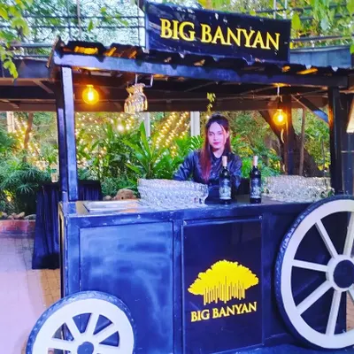 An example of our themed mobile bar carts. This rustic 'Big Banyan' wine cart is perfect for outdoor events, garden parties, and weddings, adding a touch of charm and character.
