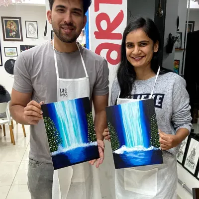 This couple created a beautiful diptych painting of a waterfall. Our couple canvas painting sessions are a great way to collaborate on a single piece of art.