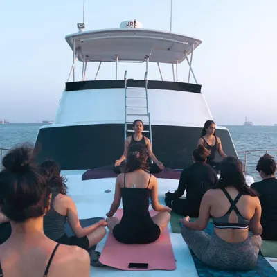 Guiding a meditation session on the deck of a yacht for our "Yoga on the Sea" event. Finding stillness amidst the gentle movement of the water is a powerful experience.