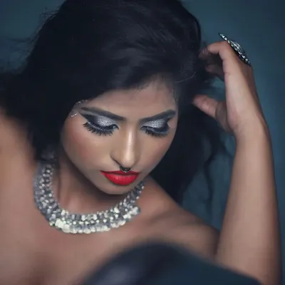 A classic high-fashion look for a portfolio shoot. I created this intense silver glitter cut-crease eye makeup with a sharp wing and a bold matte red lip for maximum impact.