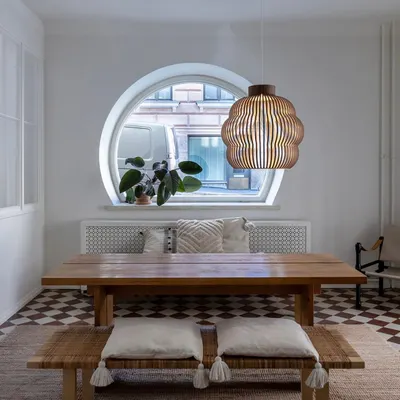 This slatted birch wood pendant, designed by architect Seppo Koho, hangs beautifully in a dining nook. Its form is inspired by summery cumulus clouds and casts a warm, inviting light.
