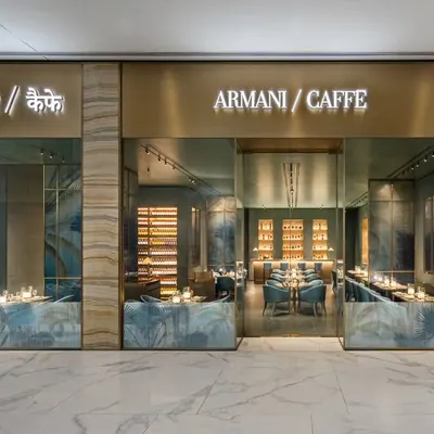 The storefront of Armani Caffe is the first impression for any guest. I shot this to highlight the seamless integration of the brand's iconic name with the elegant marble and glass facade, creating a clear and luxurious invitation into the space.