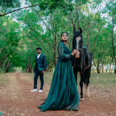 This pre-wedding shoot in the forest with a horse feels like a scene from a movie. It's a perfect concept for couples who want something grand and different.