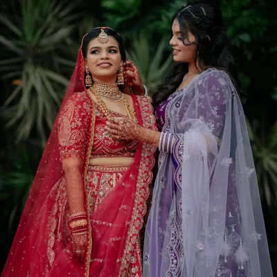 A sweet moment between the bride and her sister. We love capturing the special bonds and quiet interactions that happen amidst the wedding buzz.