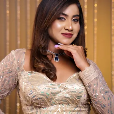 A soft, glamorous hairstyle with gentle waves, perfect for a reception or cocktail party. This look adds volume and movement, complementing the modern sequined lehenga.