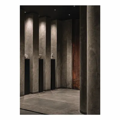 This space from our 'Frozen' project embodies Zen design, elevating simplicity to an art form. We used natural materials, dramatic lighting on textured columns, and a rejection of clutter to create a minimalist and meaningful retail experience.