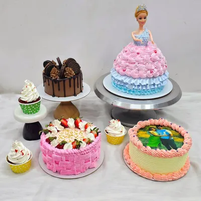 A beautiful display of cakes made by a student in my comprehensive Basic to Advanced class. You'll learn a variety of styles, including a Barbie doll cake, a fresh fruit basket-weave cake, a chocolate drip cake, and photo-print cakes.