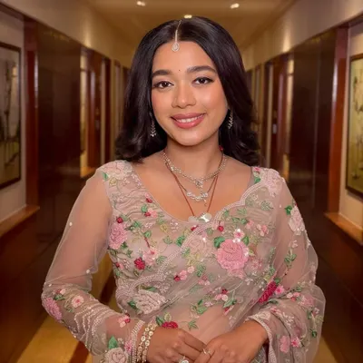She was a flower girl, blooming in every shade we used on her. This reception look is effortlessly glowing, with soft pinks and a radiant finish that complements her floral saree.