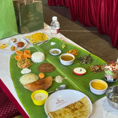 A beautifully arranged banana leaf meal prepared for a naming ceremony. Each component, from the kosambari to the payasam, is placed with care, ready to be enjoyed.