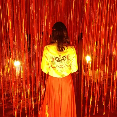 My hand-painted Durga jacket, designed for my first Garba event in Ahmedabad. Wearing your own art is a special feeling, and this piece, set against a vibrant red backdrop, truly captures the festive spirit.