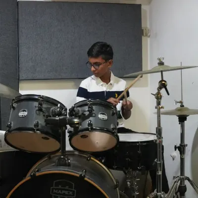 A quiet moment of a student learning and growing on the drums. Each lesson is different, but always moving forward.