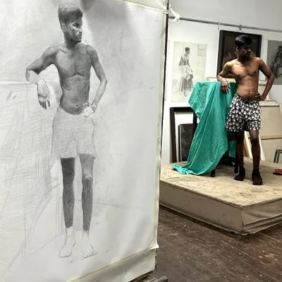 A life drawing session at J.J. School of Art, showing my large-scale graphite drawing next to the model. This is the foundation of understanding human anatomy.