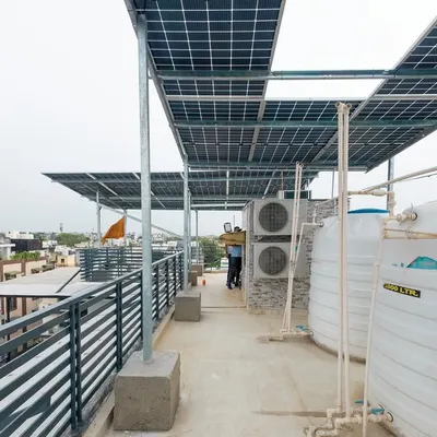 A completed 9 kW rooftop solar project in Rohini, Delhi. The elevated design ensures the panels get maximum sunlight throughout the day without obstructing the rooftop area, which remains available for the family to use.