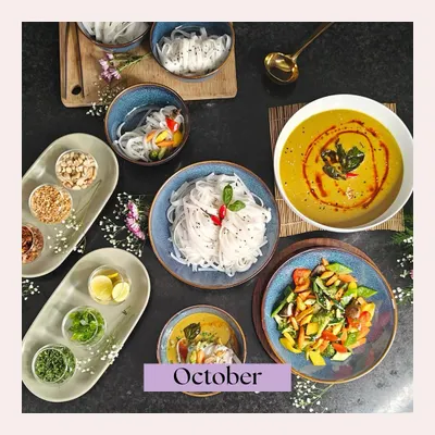 A beautifully deconstructed Khow Suey from our October highlights. This overhead shot shows the rich coconut curry, noodles, and a variety of fresh toppings, ready to be assembled into a perfect bowl.