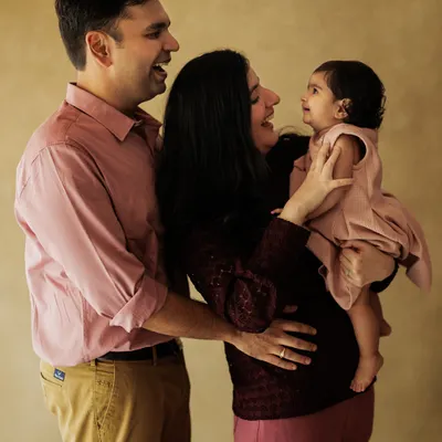 An unscripted moment of pure family joy. This candid lifestyle portrait captures the genuine laughter and love that you'll want to remember forever.