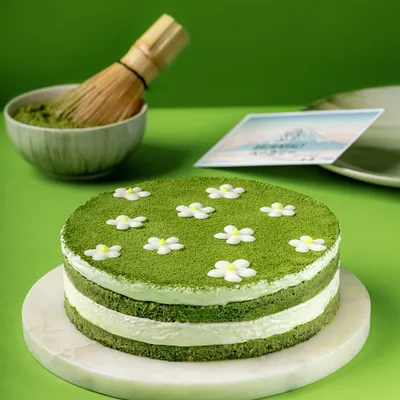 My Matchamisu, a Japanese twist on the classic tiramisu. It features layers of matcha-soaked sponge and creamy mascarpone, decorated with delicate sugar flowers.