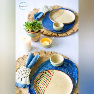 You can't buy love, but you can buy handmade, and that's pretty close. This dinnerware set, with its organic shapes and hand-painted details, is ready to make your meals feel a little more special.