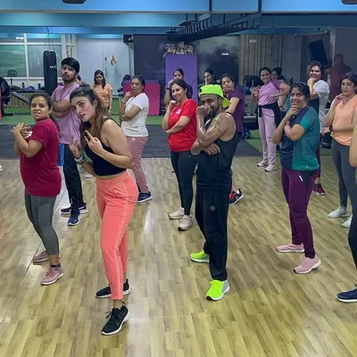 A snapshot of the pure fun in our Zumba class. Everyone is engaged, smiling, and moving to the beat in this high-energy group fitness session.