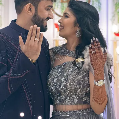 The perfect engagement shot. The bride's beautiful, dark mehendi stain is on full display as she shares a moment with her fiancé.