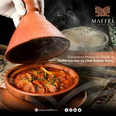 The moment we unveil our signature Moroccan Tagine. Steam rises from the traditional clay pot to reveal a rich, aromatic stew of tender meat and vegetables, slow-cooked to perfection.