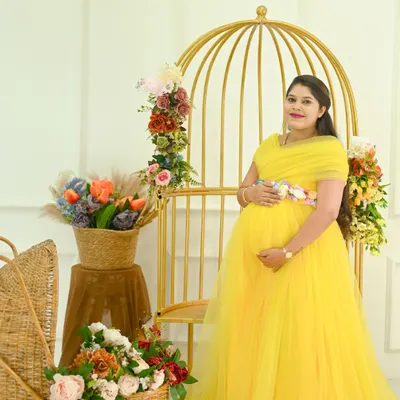 A classic solo portrait in my studio. The bright yellow gown looks so cheerful against this elegant setup with the golden birdcage and floral arrangements.