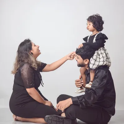 A perfect family moment. We love capturing the joy and playfulness between parents and their children, like this sweet shoulder-ride pose.