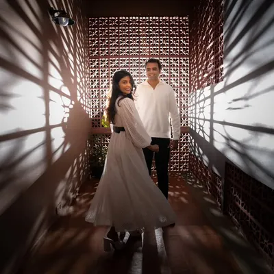 A creative portrait using dramatic shadows from a lattice wall. I love finding unique architectural details and using light to create artistic and memorable pre-wedding photos.