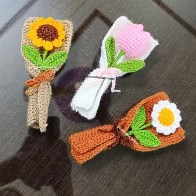 A set of our three most popular mini bouquets: sunflower, tulip, and daisy. Each one is carefully crafted by hand and wrapped to look like a real miniature floral arrangement.